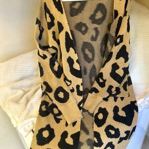 Cheetah print cardigan. Knee length and I’m 5’9.